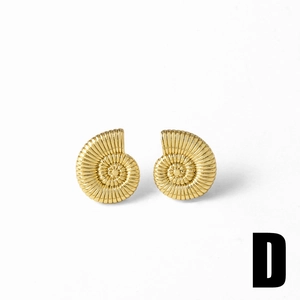 Macro detail of gold-plated nautilus shell stud earrings with spiral texture and 18k finish