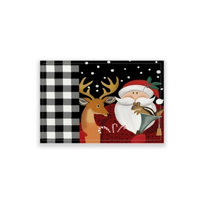 Christmas placemat with Santa and reindeer patterns on a red checkered festive background