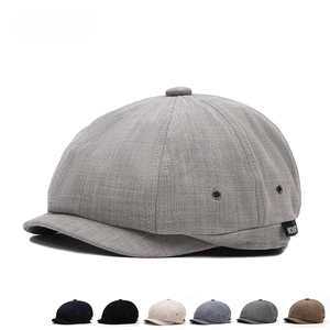 Men's newsboy cap in textured fabric available in six neutral colors for summer sun protection