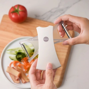 Dual-blade stainless steel peeler and grater for fruits and vegetables in kitchen use
