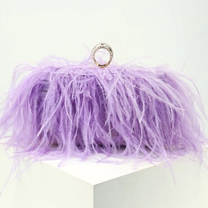 Lavender ostrich feather clutch bag with a crystal-encrusted gold ring handle