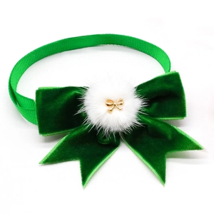 Green velvet pet bowtie collar with white faux fur pompom and gold metal charm