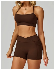Detail of chocolate brown yoga set with V-shaped waistband and side pockets