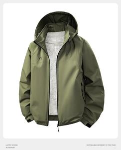 Detail of army green windproof jacket showing warm white fleece lining and zipper