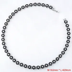 Detailed macro of flower necklace with white diamonds and black petals, 8mm width