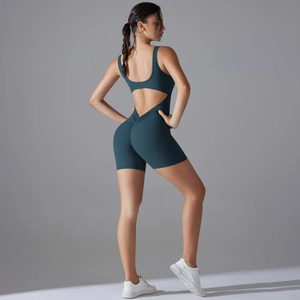 Detail of the deep green yoga romper featuring a backless design and scrunch butt lifting effect