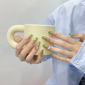 Green gradient cat eye press-on nails with luxury rhinestones on long coffin shape