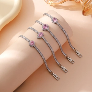 Elegant silver bracelet featuring sparkling pink zircon in four distinct gemstone shapes