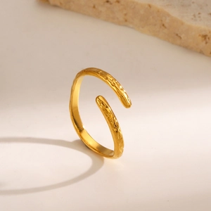 Minimalist 18K gold-plated stainless steel open ring with hammered texture on beige surface
