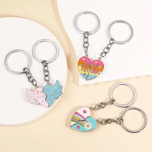 Close-up of three pairs of enamel heart puzzle keychains with Best Friends lettering