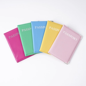 Multi-color PU leather passport covers in pink, blue, yellow, and green arranged in a fan shape
