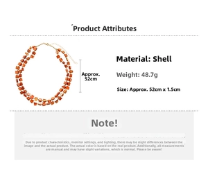 Detail view of double-layer orange shell bead necklace with dimensions and gold buckle