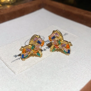Close-up of gold-plated pony stud earring featuring colorful rectangular-cut zircon stones