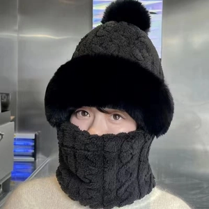 Close-up of a women's black integrated winter hat with plush mask and neck warmer.