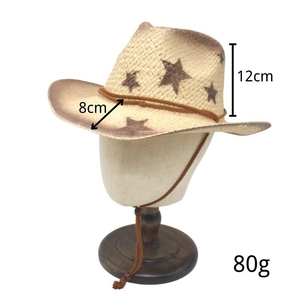 Detail view of woven cowboy hat with star motifs, wind rope, and 12cm height measurement