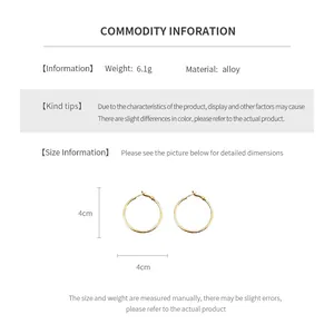 Detailed view of silver hoop earrings showing a 4cm diameter size measurement guide