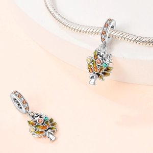 Detail of 925 silver fall tree charm with colorful enamel leaves and Fall engraving