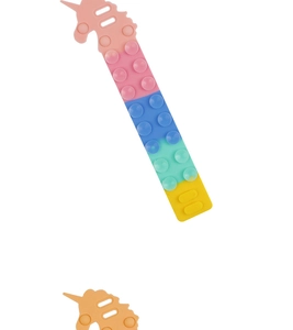 Close-up of rainbow unicorn silicone suction cup toy with colorful textured details