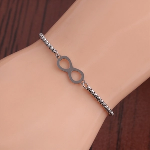 Macro shot of polished silver infinity symbol bracelet on a thin round link chain