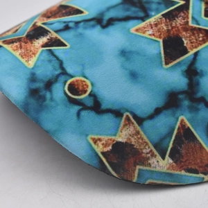 Macro view of blue marble texture and star pattern on fabric ponytail baseball cap