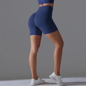Detail of navy seamless high-waisted yoga shorts with ribbed texture and butt-lifting design