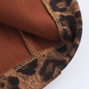 British style leopard print faux suede coat with double-breasted detail and brown lining