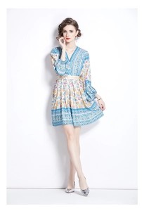 Close-up of Bohemian floral print fabric with V-neckline and braided waist belt detail
