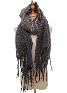 Detail of herringbone knit scarf with colorful flecks and long fringe tassels