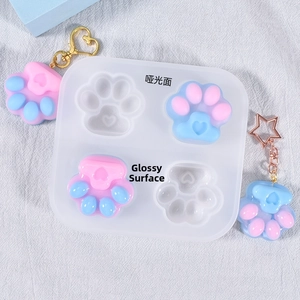 Detail of 4-slot cat paw silicone mold showing matte and mirror finish resin effects