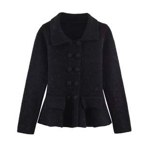 Detailed close-up of a black tweed-style double-breasted knit cardigan with silver buttons