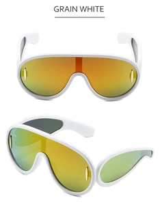 Detail view of grain white frame with orange-green gradient lenses on sporty sunglasses