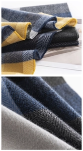 Detailed macro view showing the soft herringbone texture and plaid pattern of the scarf