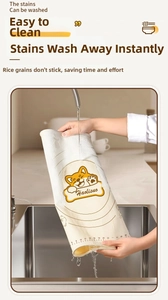 Waterproof food-grade silicone baking mat being rinsed under a faucet in a sink