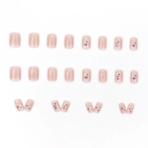 Reusable press-on nails set with gradient floral patterns and glossy nude pink finish