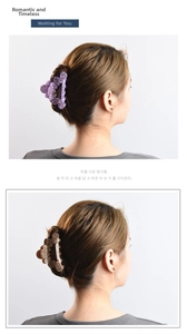 Rear view of model wearing hollow wave hair claw clips with sparkling rhinestones