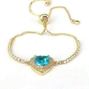 Adjustable gold heart bracelet with blue zircon stone and sparkling halo setting