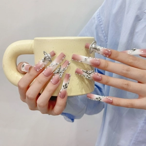 Extra long pink ombre press-on nails with 3D butterfly, orb charms and pearls