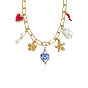 Gold chain necklace featuring baroque pearl, red heart, and shell charms on white background