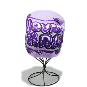 Detailed knit texture of purple beanie featuring lover GIRL text and cherry graphics