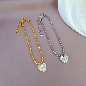 Minimalist stainless steel bead bracelets with sparkling heart charms in gold and silver
