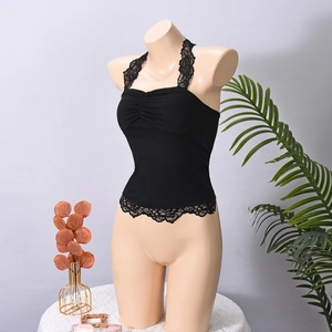Detail view of black halter top with delicate lace trim and pleated bust design