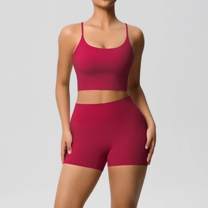 Detail of burgundy ribbed yoga set featuring a strapless sports bra and high-waisted shorts
