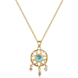 Dreamcatcher necklace with blue gemstone and sparkling crystals on golden steel chain
