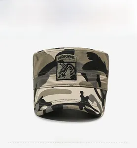 Detail of military camo flat top cap with embroidered eagle airborne shield patch