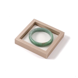 Minimalist light green jadeite round bangle bracelet in champagne gold frame display