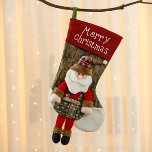 Detailed close-up of a festive Christmas stocking with Santa Claus and embroidery
