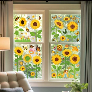 Detailed view of sunflower and butterfly static window clings in a bright home living room