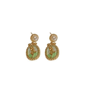French vintage tulip earrings with green oil drip pattern and pearls on white background