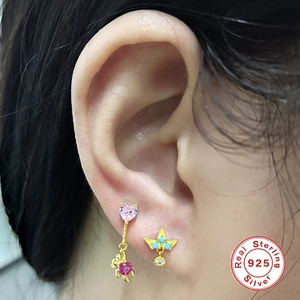 Close-up of S925 sterling silver mini floral stud earrings with colorful crystals
