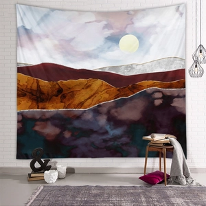 Modern abstract mountain tapestry detail with gold lines hanging in cozy home interior